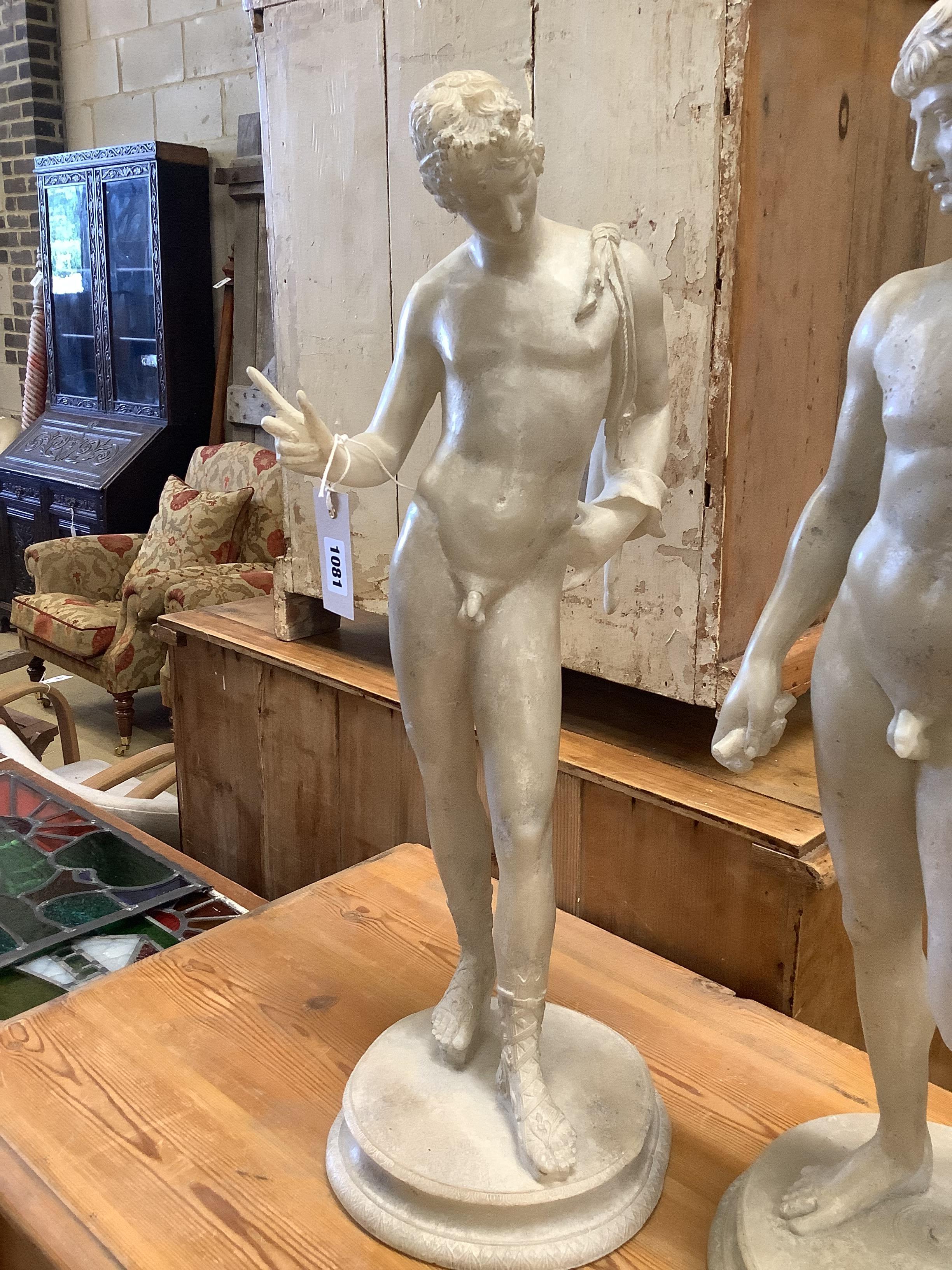 A pair of faux marble classical figures, larger 62cm high